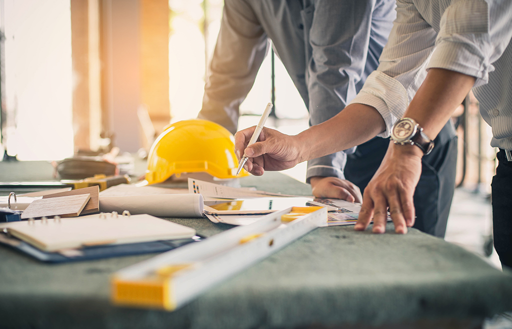 Contractors looking at plans for building