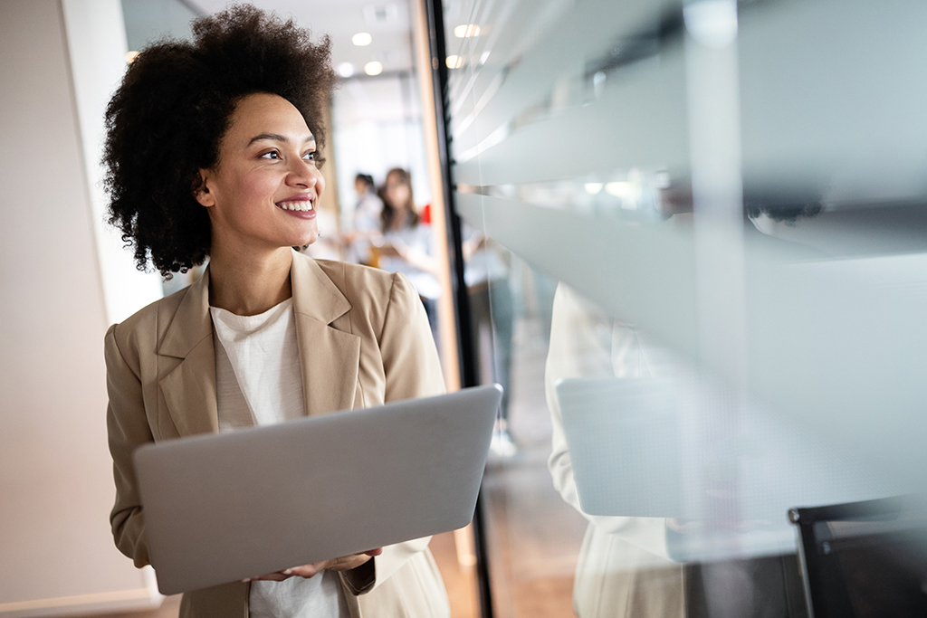 IT Worker holding a laptop